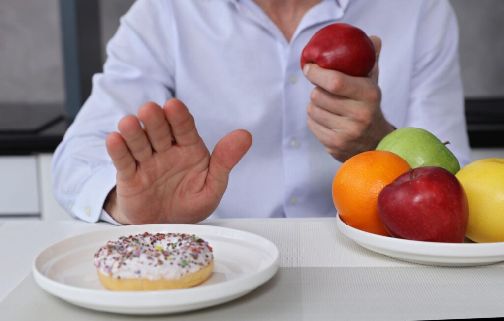 person choosing healthy foods to reduce sugar intake